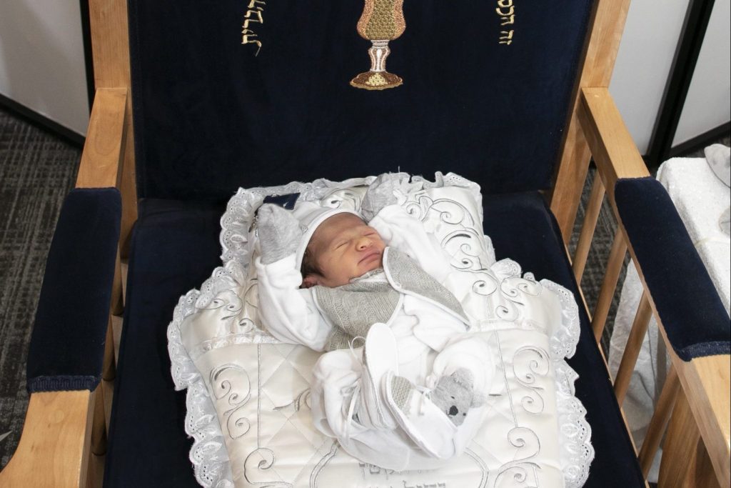 Baby lying on Chair of Elijah