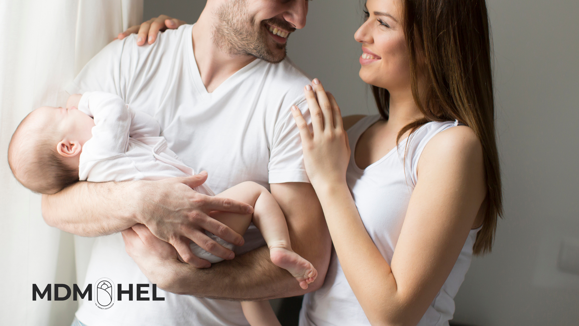 Mother and father holding baby Mother and father holding baby