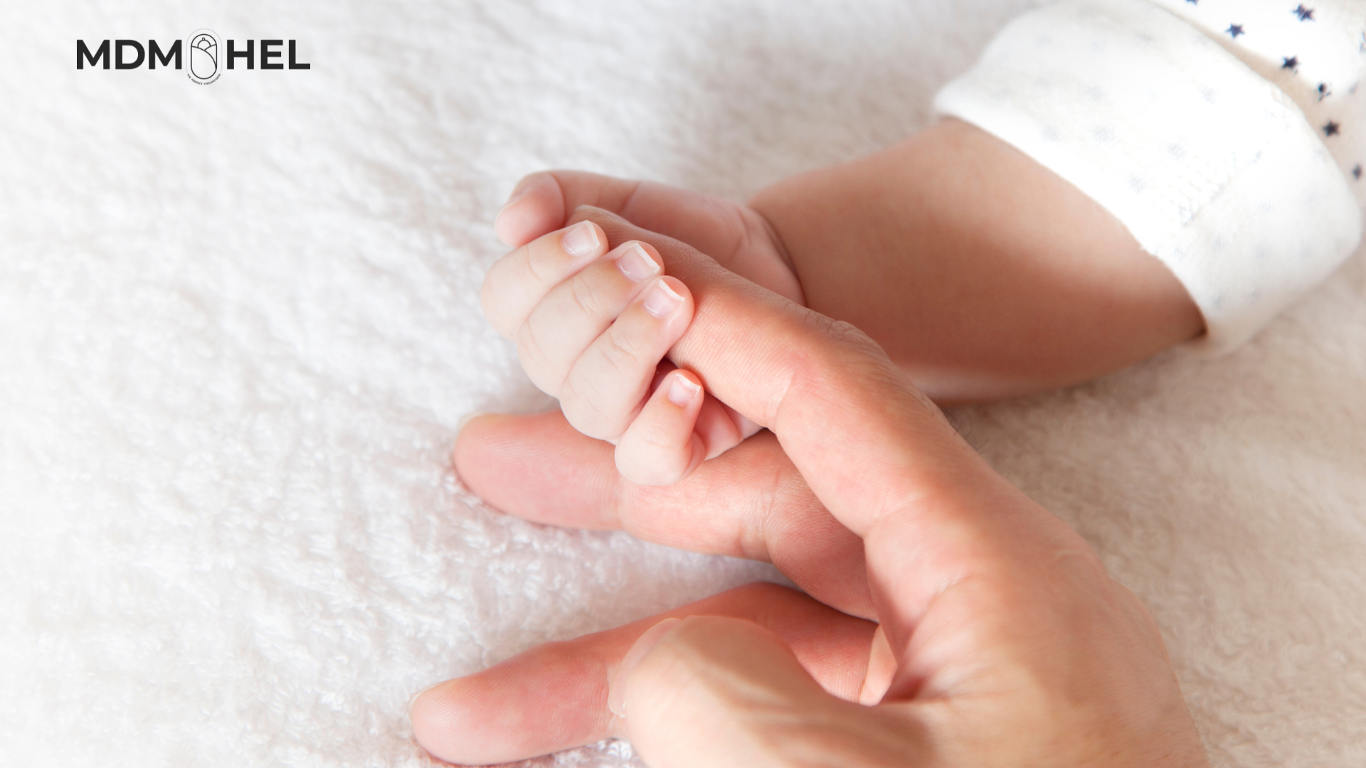 Baby holding parent finger Baby holding parent finger