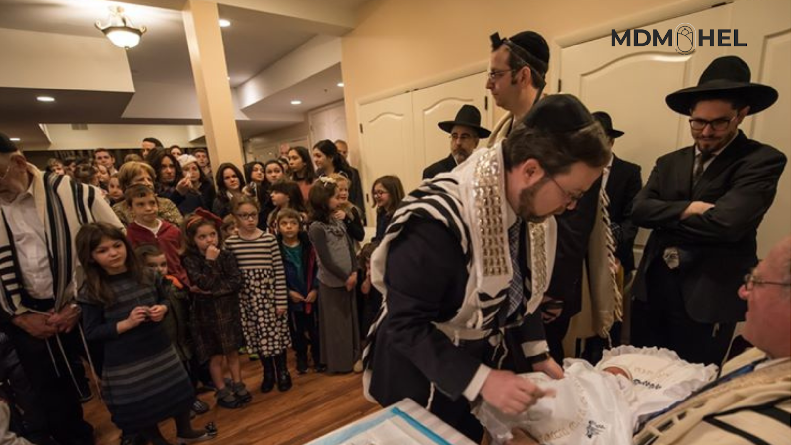 Rabbi Rappaport conducting Bris milah ceremony