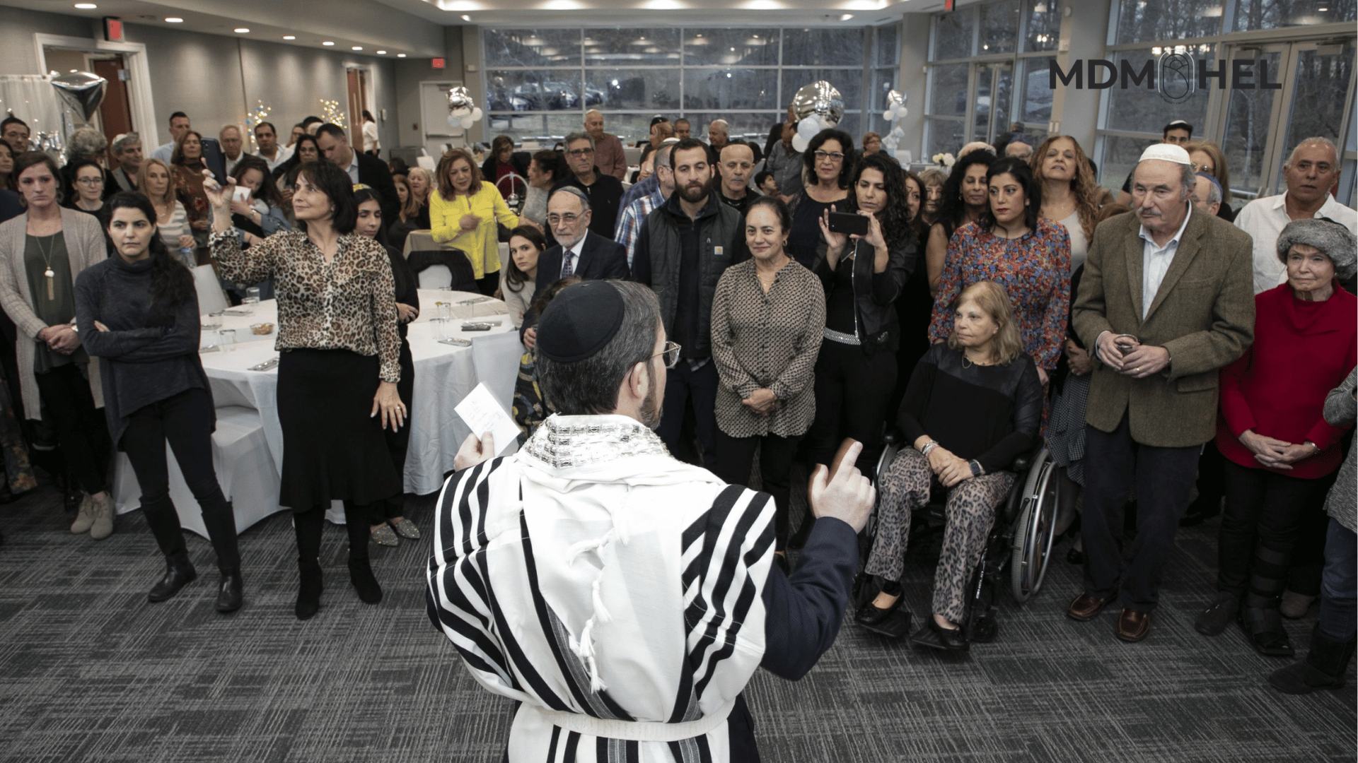 Rabbi Rappaport addressing family during Bris Milah Rabbi Rappaport addressing family during Bris Milah