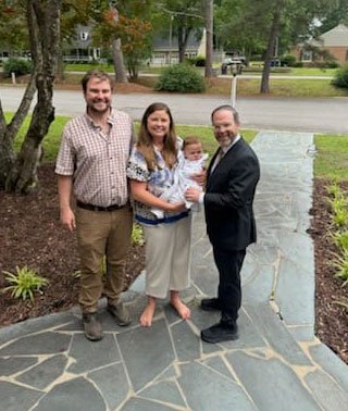 fam with rabbi in driveway