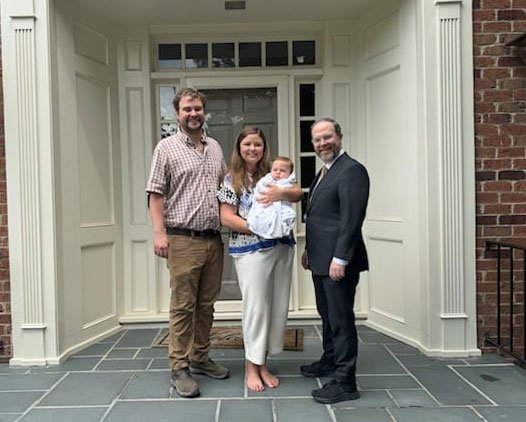 rabbi with fam outside home